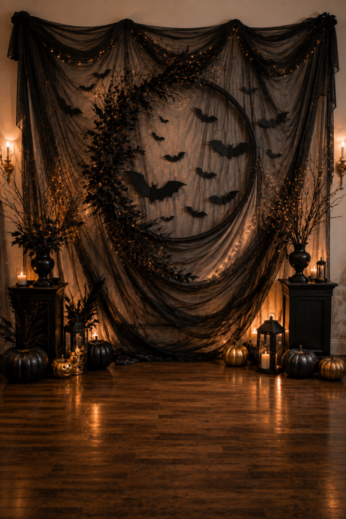 Halloween photo backdrop with dark fabric, bats, foliage, and warm party lighting